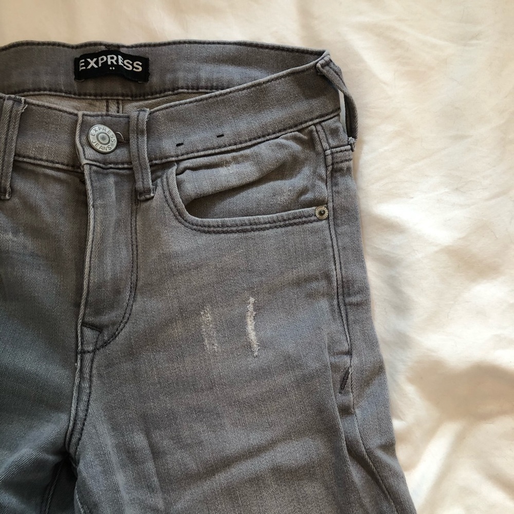 Distressed grey jeans